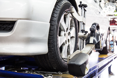 tire clamped onto wheel alignment technology