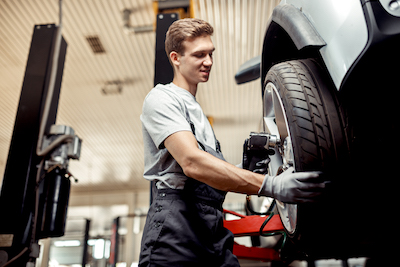 Euless auto mechanic performing tire service